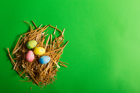 Colorful Easter eggs on a green backgroundの写真素材