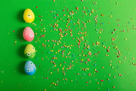 Colorful Easter eggs on a green backgroundの写真素材