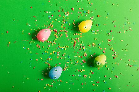Colorful Easter eggs on a green backgroundの写真素材
