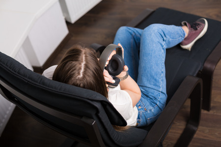 Young pretty woman relaxing at her homeの写真素材