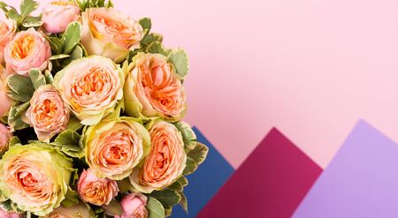 Beautiful roses vintage bouquet on a pink backgroundの写真素材