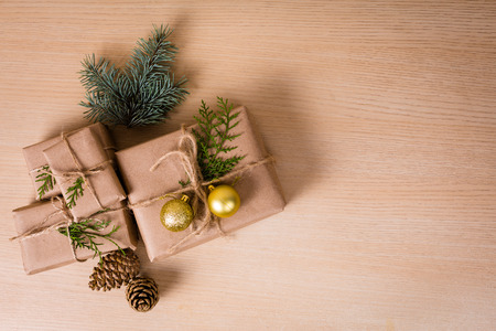 Christmas gifts with a decor on a wooden backgroundの写真素材