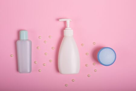 Gift box and cosmetics on a pink backgroundの写真素材