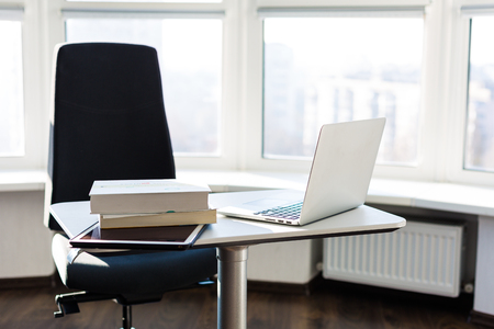 Modern office interior. Workplace with a laptopの写真素材