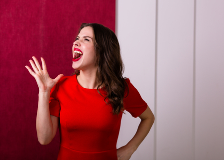 Beautiful sexy woman in a red dressの写真素材