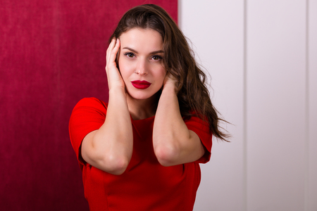 Beautiful sexy woman in a red dressの写真素材