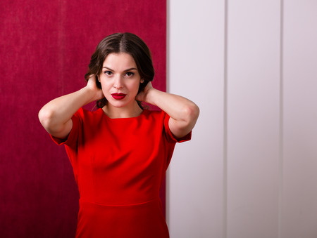 Beautiful sexy woman in a red dressの写真素材