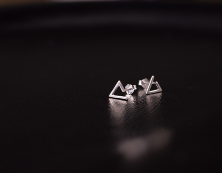 Fine silver jewelry on a black background with copy spaceの写真素材
