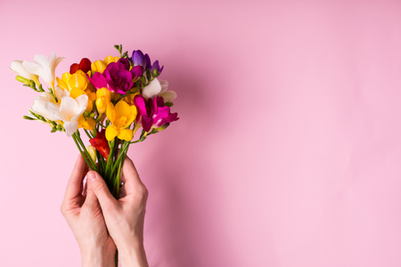 Woman holding flowers top view with a copyspaceの写真素材