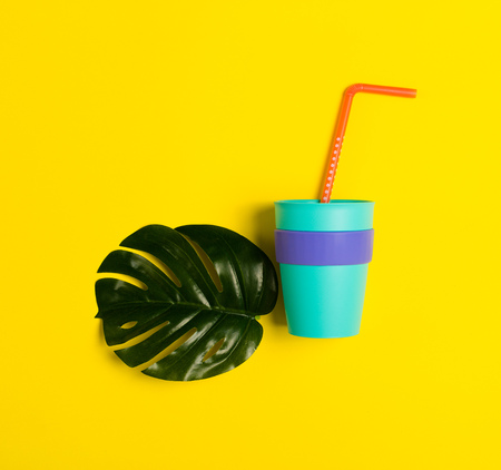 Bright summer background with a drinking strawsの写真素材