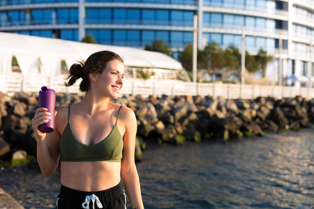 Young woman working out at the beach in the summerの写真素材
