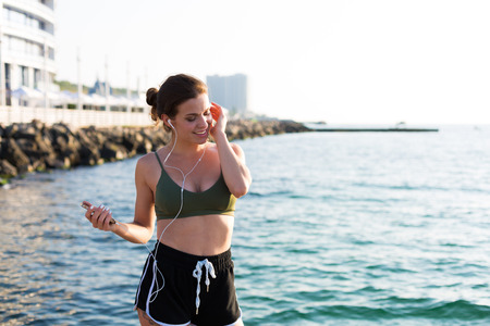 Young woman working out at the beach in the summerの写真素材