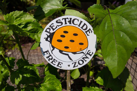 Pesticide free zone sign in the gardenの写真素材