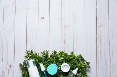 Variety of organic cosmetics on a green spring grass backgroundの写真素材