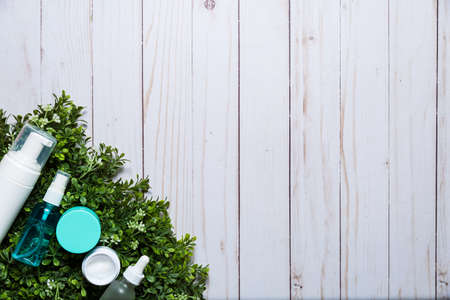 Variety of organic cosmetics on a green spring grass backgroundの写真素材