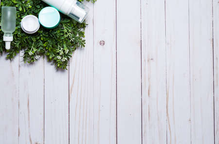 Variety of organic cosmetics on a green spring grass backgroundの写真素材