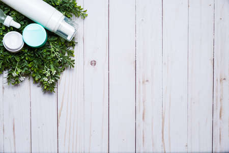 Variety of organic cosmetics on a green spring grass backgroundの写真素材