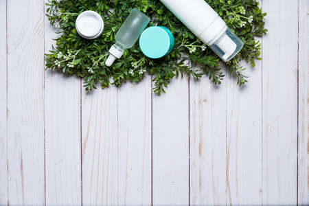 Variety of organic cosmetics on a green spring grass backgroundの写真素材