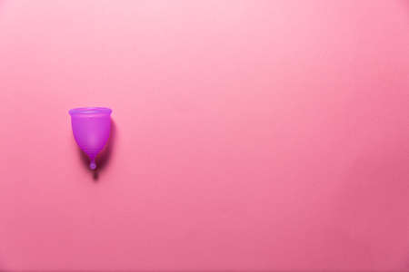 Feminine hygiene products on bright pink background. Menstruation conceptの写真素材