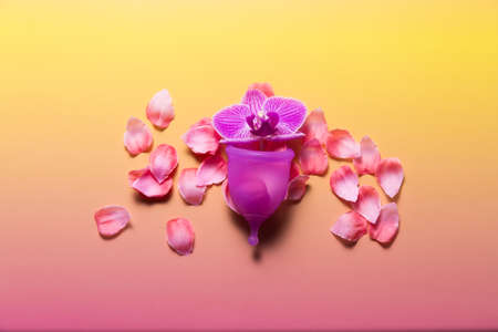 Feminine hygiene products on bright pink background. Menstruation conceptの写真素材