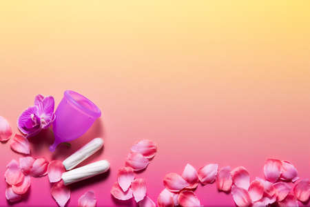 Feminine hygiene products on bright pink background. Menstruation concept