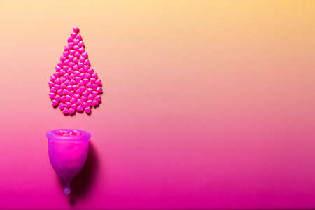 Feminine hygiene products on bright pink background. Menstruation conceptの写真素材
