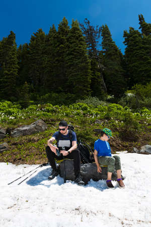 Father and son hiking at Cascade mountains, Mt. Rainier National Parkの写真素材