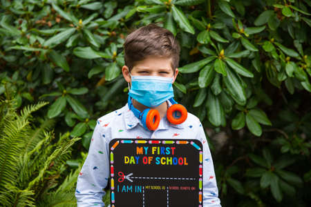 Schoolboy wearing a face mask. Back to school conceptの写真素材