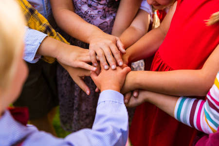 Kids standing in the circle and joining hands together