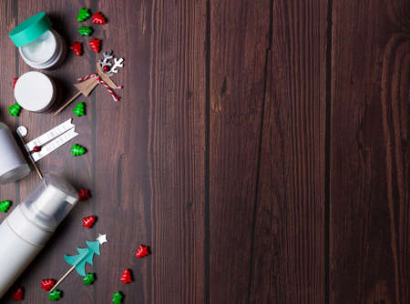 Christmas background with wooden table and decor flat layの写真素材