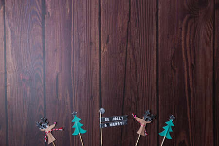 Christmas background with wooden table and decor flat layの写真素材