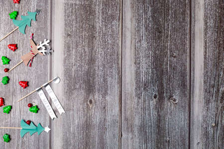 Christmas background with wooden table and decor flat layの写真素材
