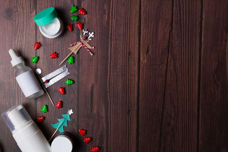 Christmas background with wooden table and decor flat layの写真素材