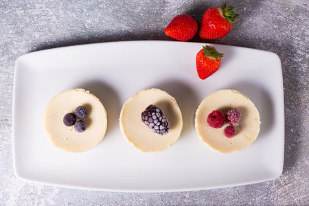 Cheesecake with delicious berries on a plateの写真素材