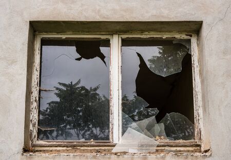 Burglary with broken window paneの写真素材
