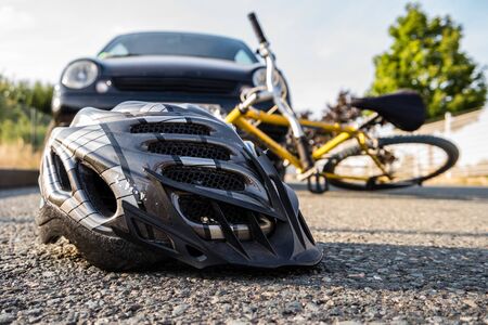 Accident by bike with helmetの写真素材