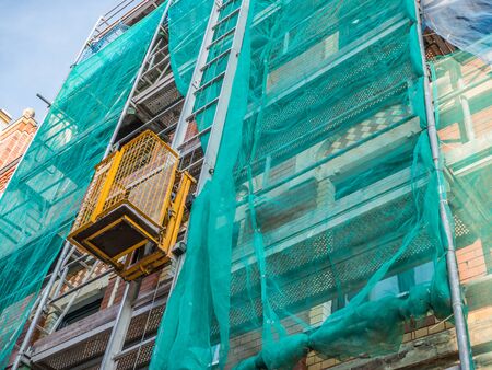 scaffolding with freight elevatorの写真素材