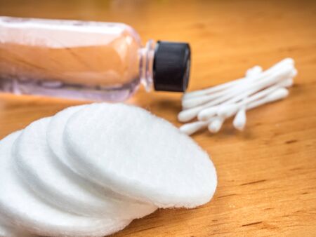Cotton pads with cotton swabs and nail polish removerの写真素材