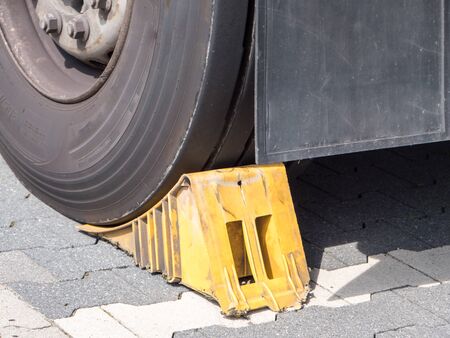 chock at the wheel of a parked truck