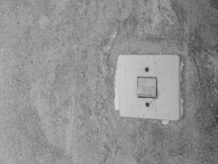 Vintage light switch in an apartmentの写真素材