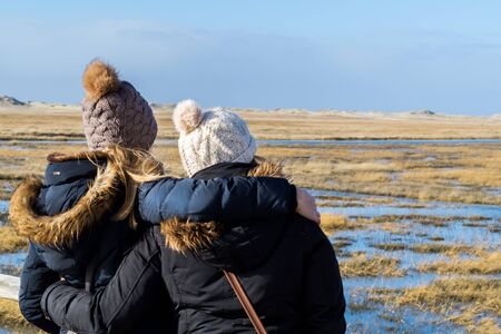 Friendship of two girls in the winter