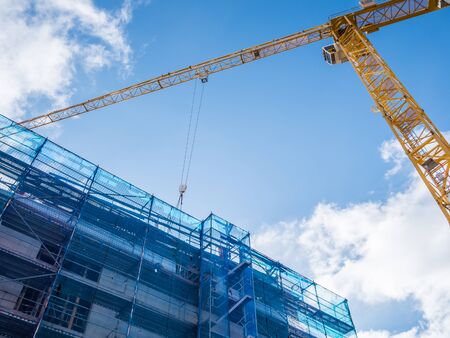 Large construction site in the city with crane