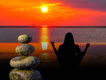 Yoga and meditation. Silhouette with stones in balance