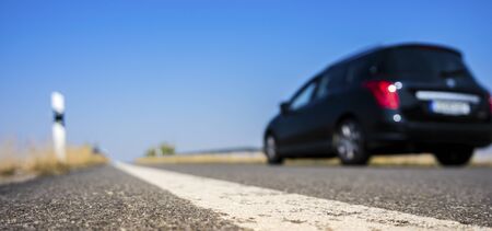 Country road with a carの写真素材