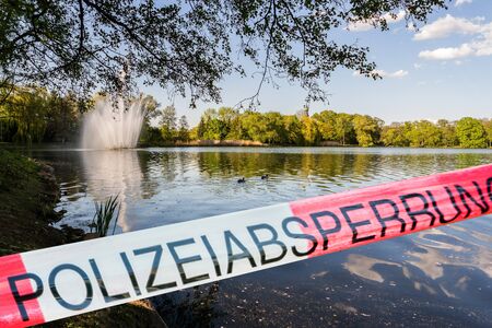 Police cordon tape in Germanの写真素材