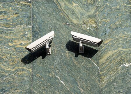 Two surveillance cameras in the  city