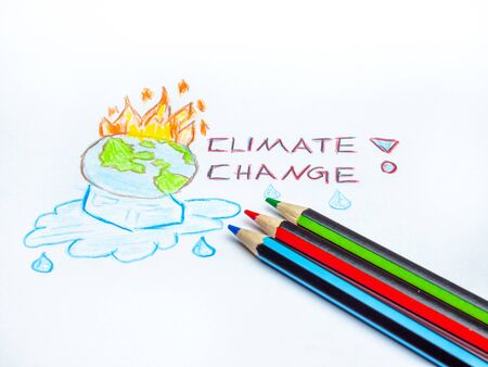 Climate change painted earth with fire and ice cubesの写真素材