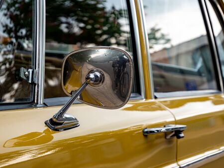 Old classic car with chrome wing mirror