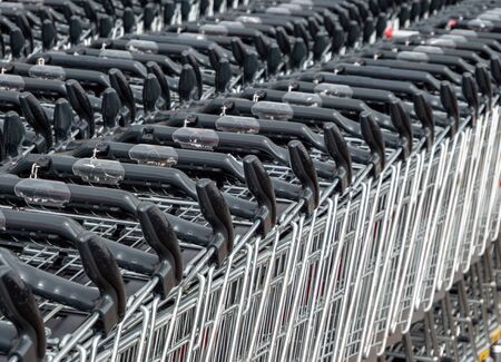 Many shopping carts in front of the supermarketの写真素材