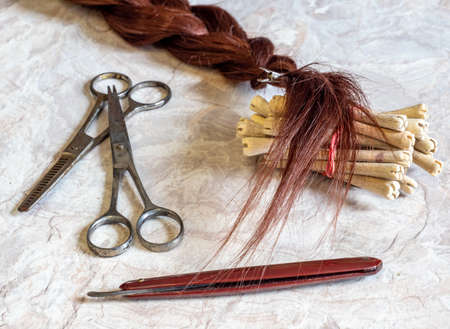 Background Antique hairdressing tool with hair braidの写真素材